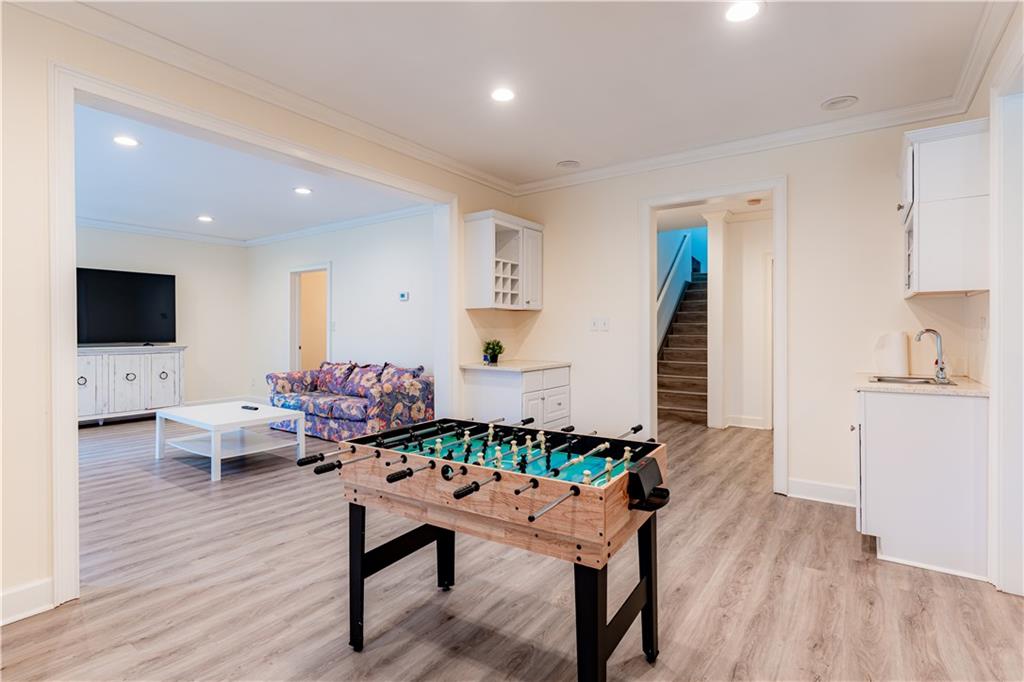 8105 Jot Em Down Road Gainesville, GA 30506 - Photo 52 of 73 a living room with furniture and a flat screen tv