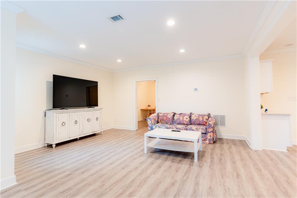 8105 Jot Em Down Road Gainesville, GA 30506 - Photo 53 of 73 a living room with furniture and a flat screen tv
