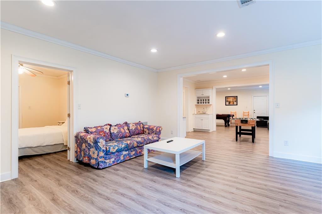 8105 Jot Em Down Road Gainesville, GA 30506 - Photo 54 of 73 a living room with furniture and wooden floor
