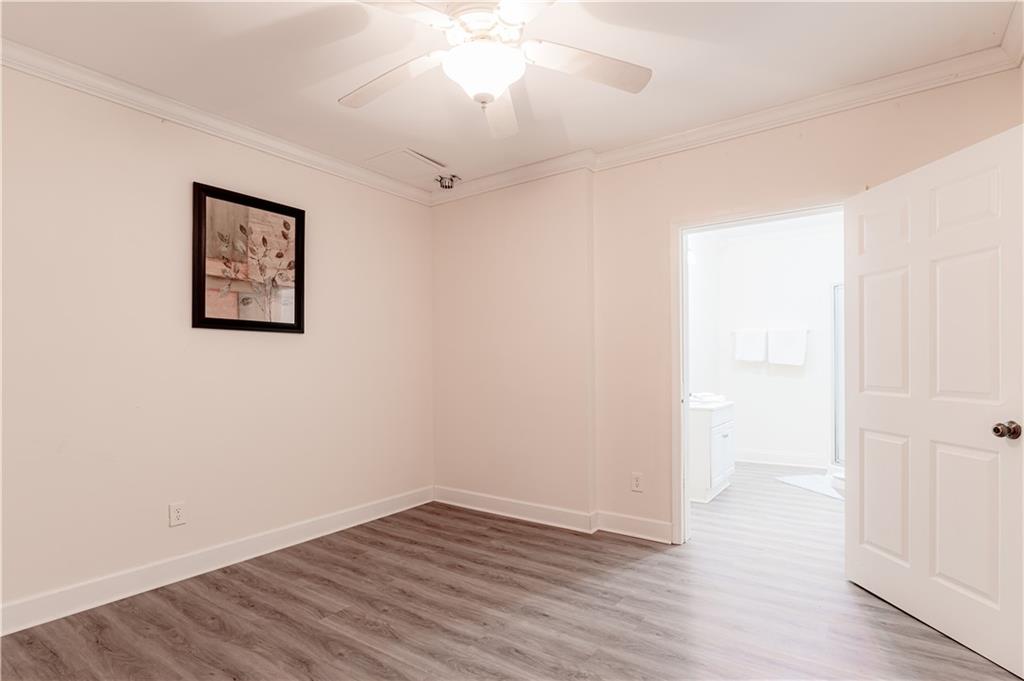 8105 Jot Em Down Road Gainesville, GA 30506 - Photo 58 of 73 an empty room with wooden floor and windows
