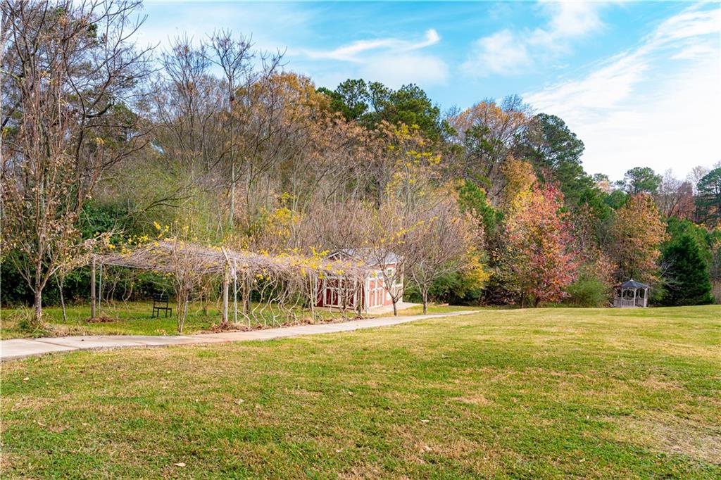 8105 Jot Em Down Road Gainesville, GA 30506 - Photo 10 of 73 a view of swimming pool with an outdoor space and seating area