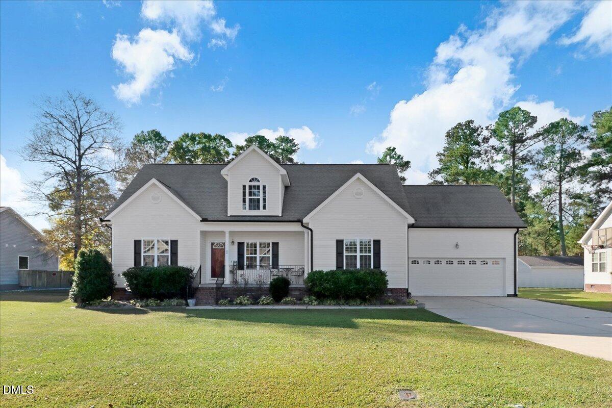 22 Quebec Drive Selma, NC 27576 - Photo 1 of 39 a view of a house with a swimming pool