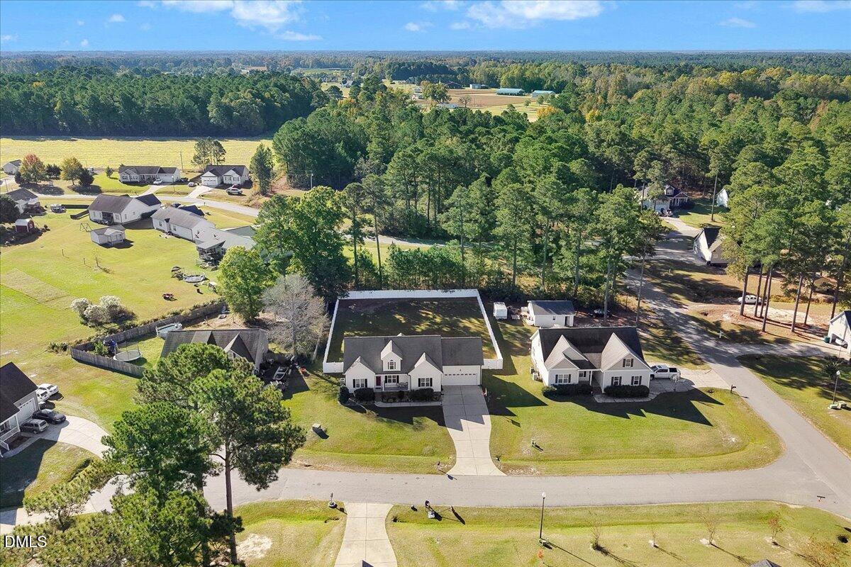 22 Quebec Drive Selma, NC 27576 - Photo 11 of 39 an aerial view of a house with a swimming pool yard and outdoor seating