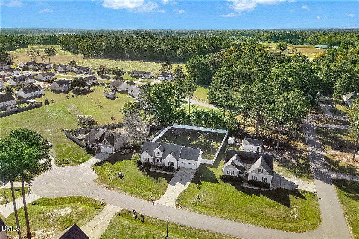 22 Quebec Drive Selma, NC 27576 - Photo 13 of 39 an aerial view of a house with a garden and lake view