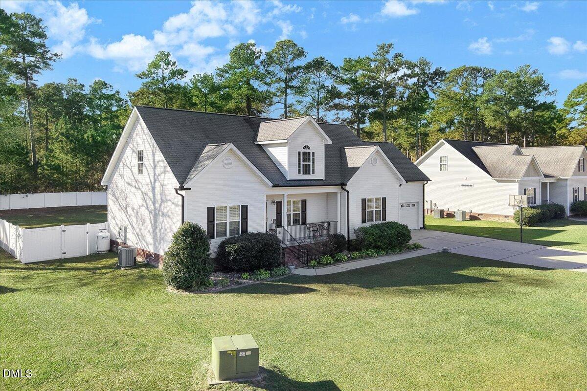 22 Quebec Drive Selma, NC 27576 - Photo 18 of 39 a view of house with garden