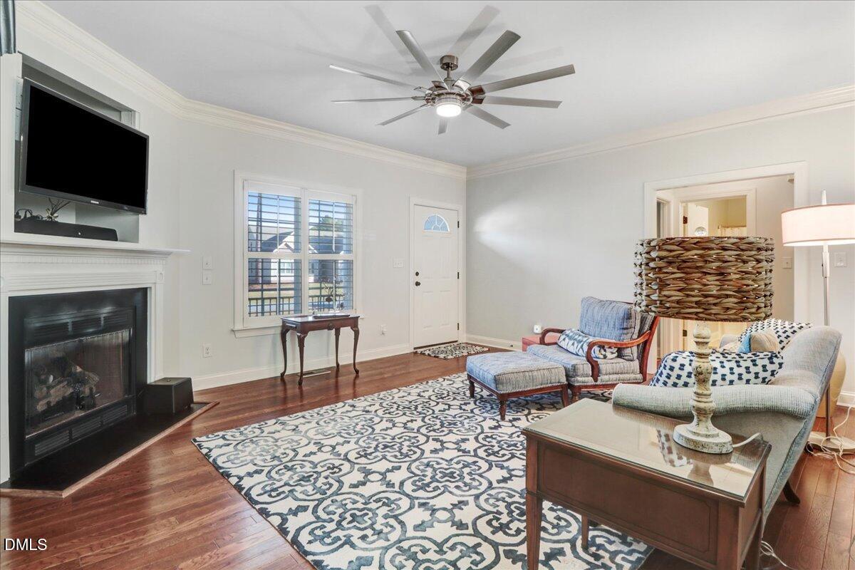 22 Quebec Drive Selma, NC 27576 - Photo 21 of 39 a living room with furniture a fireplace and a flat screen tv