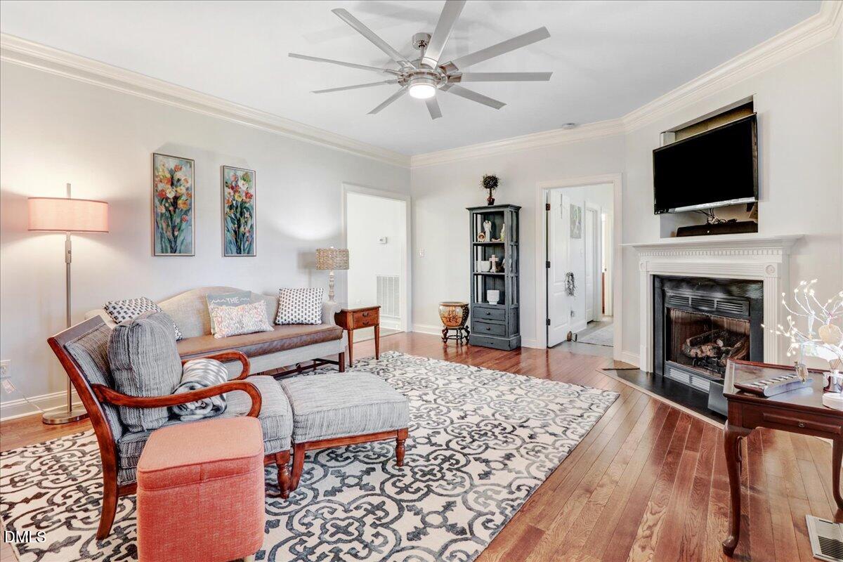 22 Quebec Drive Selma, NC 27576 - Photo 23 of 39 a living room with furniture and a fireplace