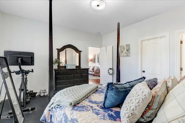 a bathroom with a double vanity sink toilet and a mirror