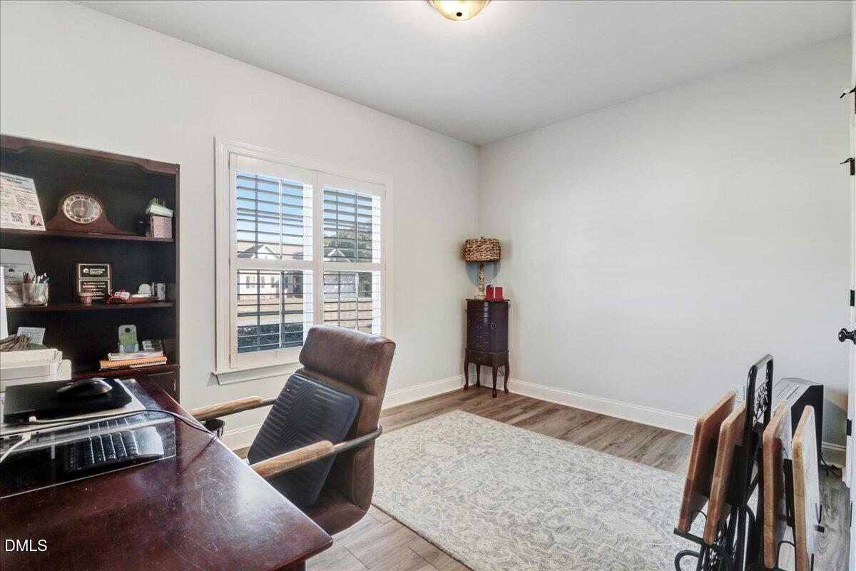 22 Quebec Drive Selma, NC 27576 - Photo 34 of 39 a living room with furniture and a flat screen tv