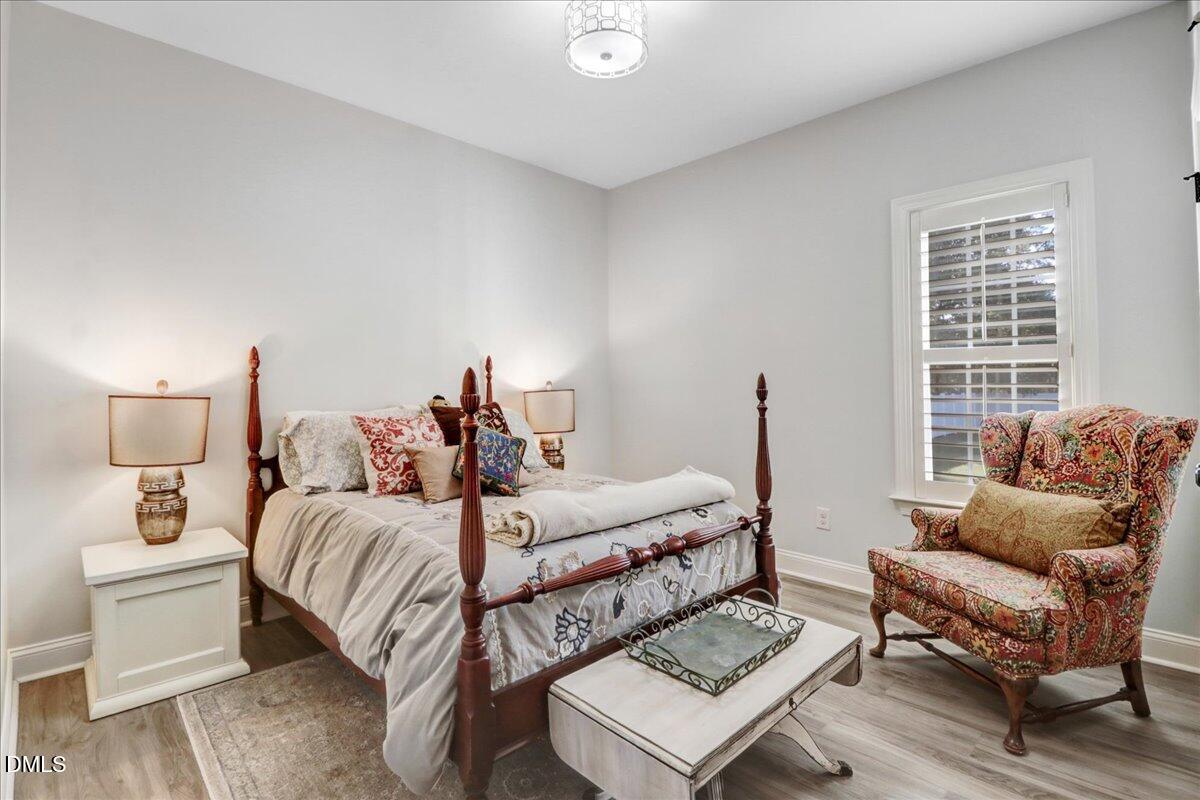 22 Quebec Drive Selma, NC 27576 - Photo 36 of 39 a bedroom with a bed and a couch