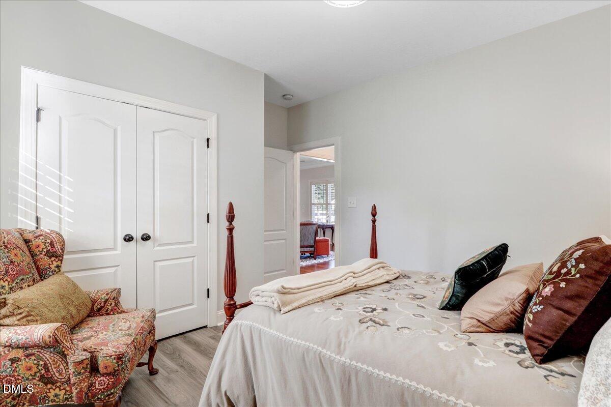 22 Quebec Drive Selma, NC 27576 - Photo 37 of 39 a bedroom with a bed and a couch