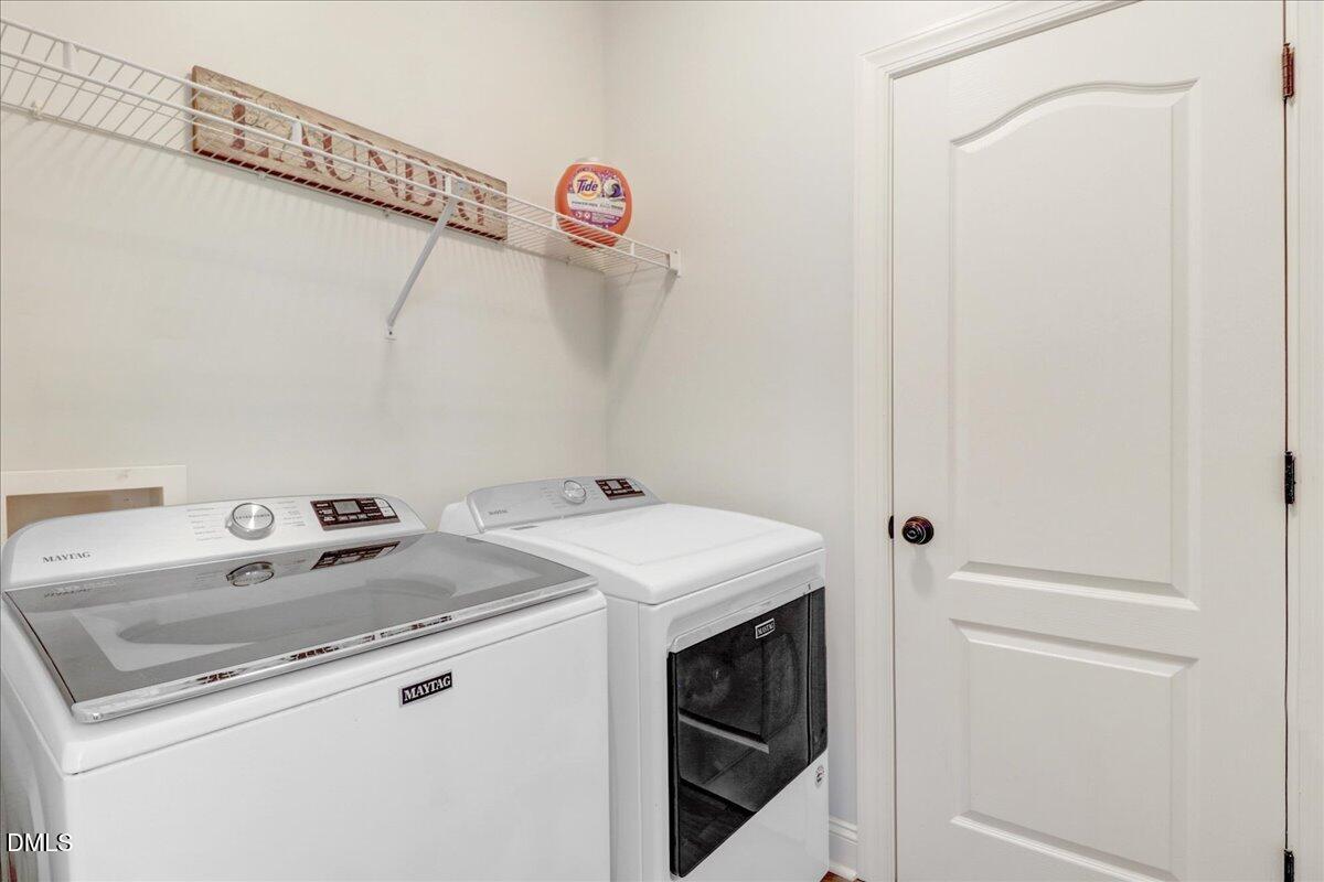 22 Quebec Drive Selma, NC 27576 - Photo 39 of 39 a utility room with dryer and washer