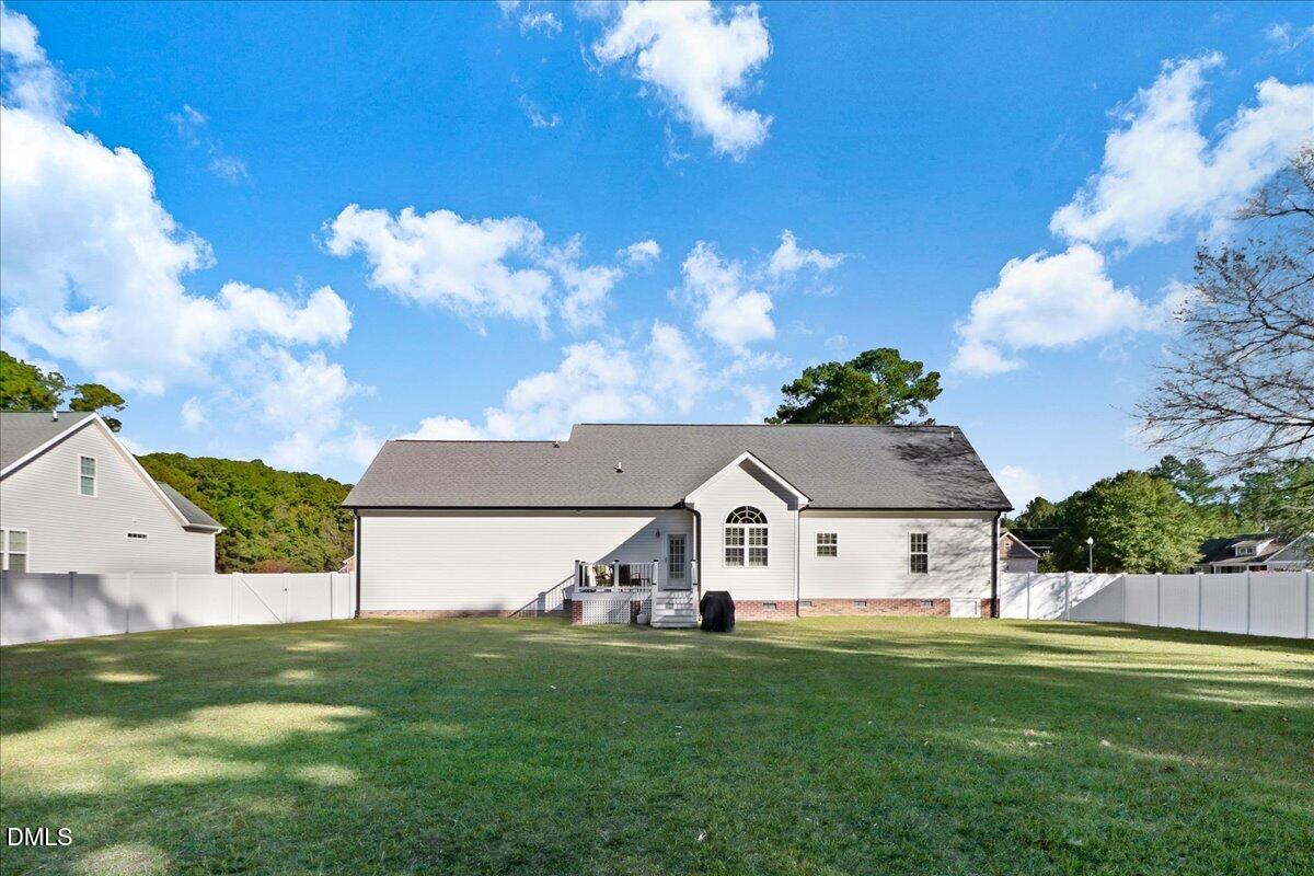 22 Quebec Drive Selma, NC 27576 - Photo 4 of 39 a view of house with garden space and street view