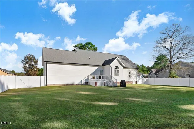 a view of a swimming pool with a yard