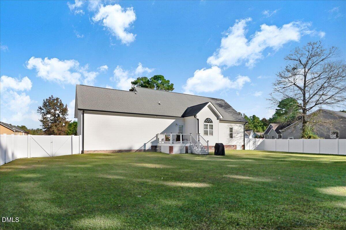 22 Quebec Drive Selma, NC 27576 - Photo 6 of 39 a view of house with garden