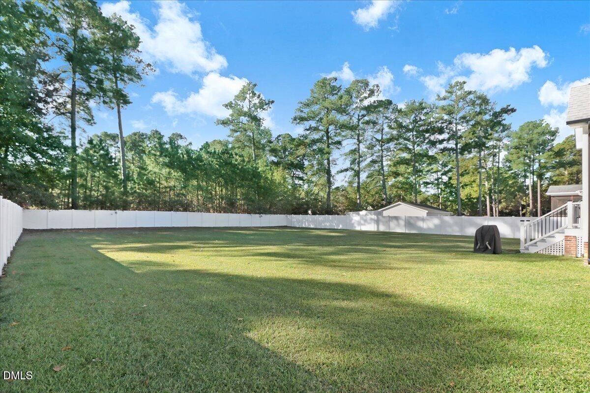 22 Quebec Drive Selma, NC 27576 - Photo 7 of 39 a view of a swimming pool with a yard