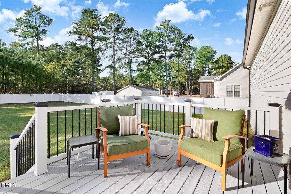 22 Quebec Drive Selma, NC 27576 - Photo 9 of 39 a view of a deck with furniture and garden