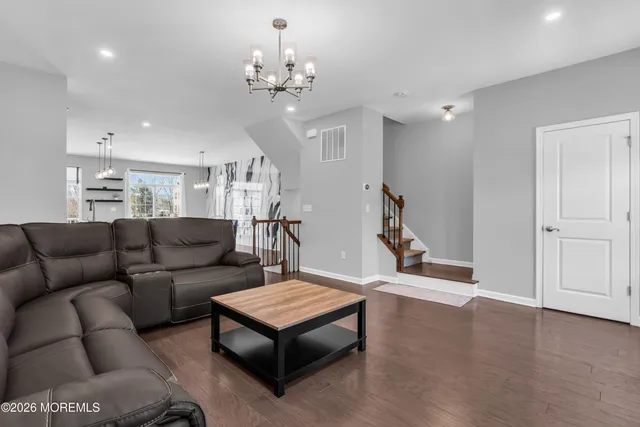 a kitchen with granite countertop stainless steel appliances and wooden cabinets