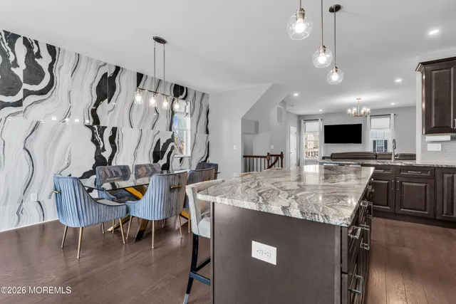 a picture of a bench in front of a wall