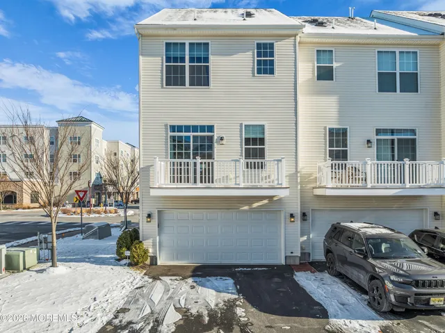 a view of a livingroom with furniture and a flat screen tv