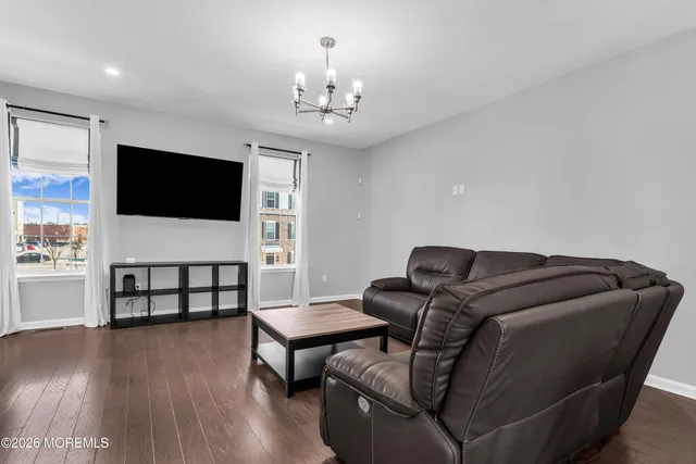a kitchen with kitchen island granite countertop a sink and cabinets