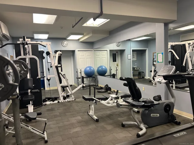 a kitchen with a refrigerator and cabinets