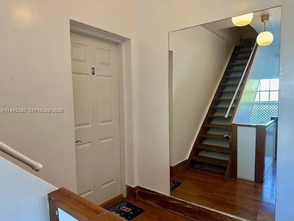 a view of entryway with wooden floor