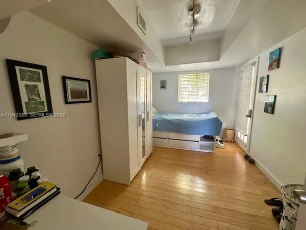a view of livingroom with hardwood floor and hallway