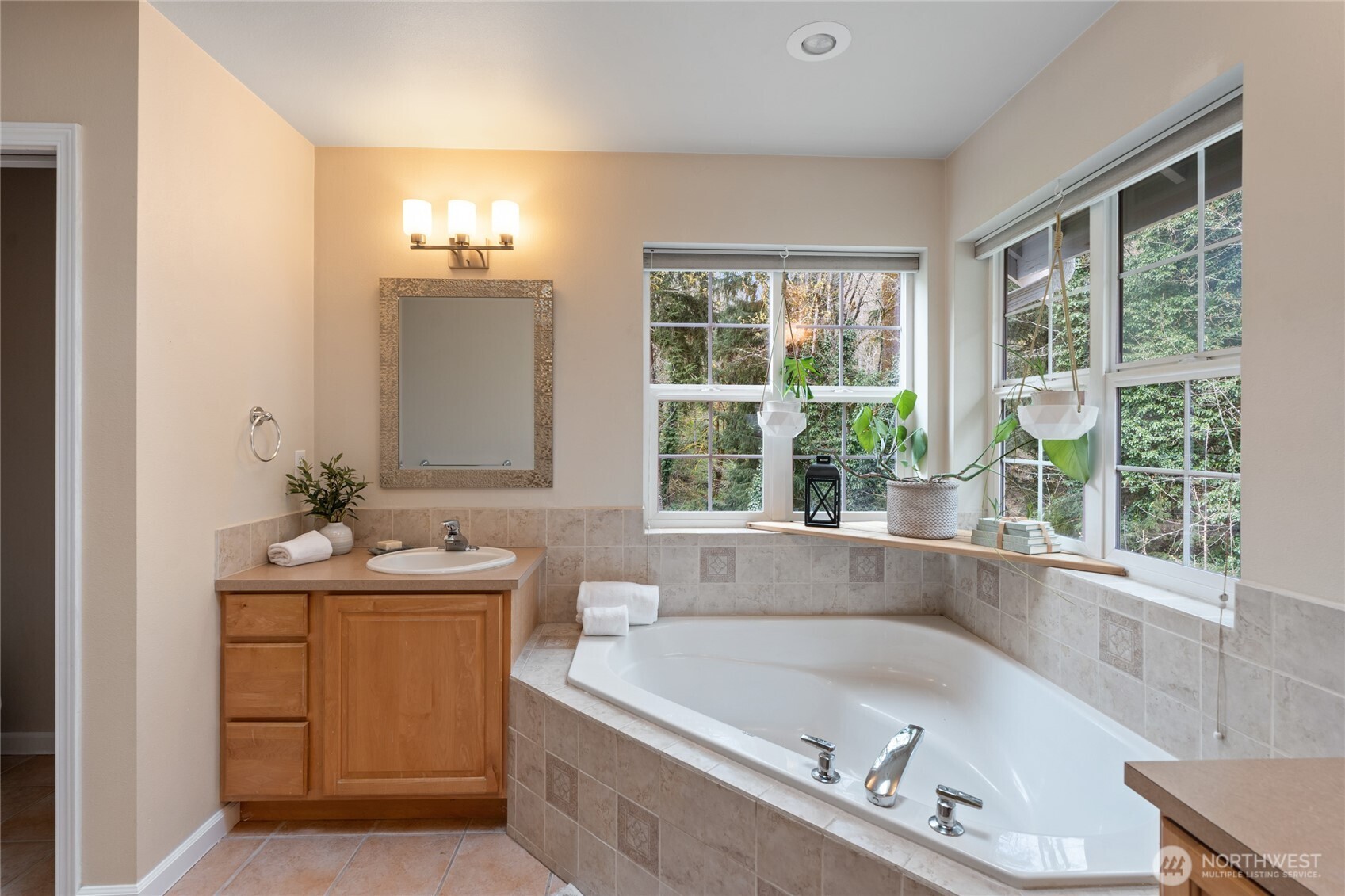 3841 Mari Lane Southeast Olympia, WA 98513 - Photo 17 of 40 a bath tub sitting in a bathroom next to a window