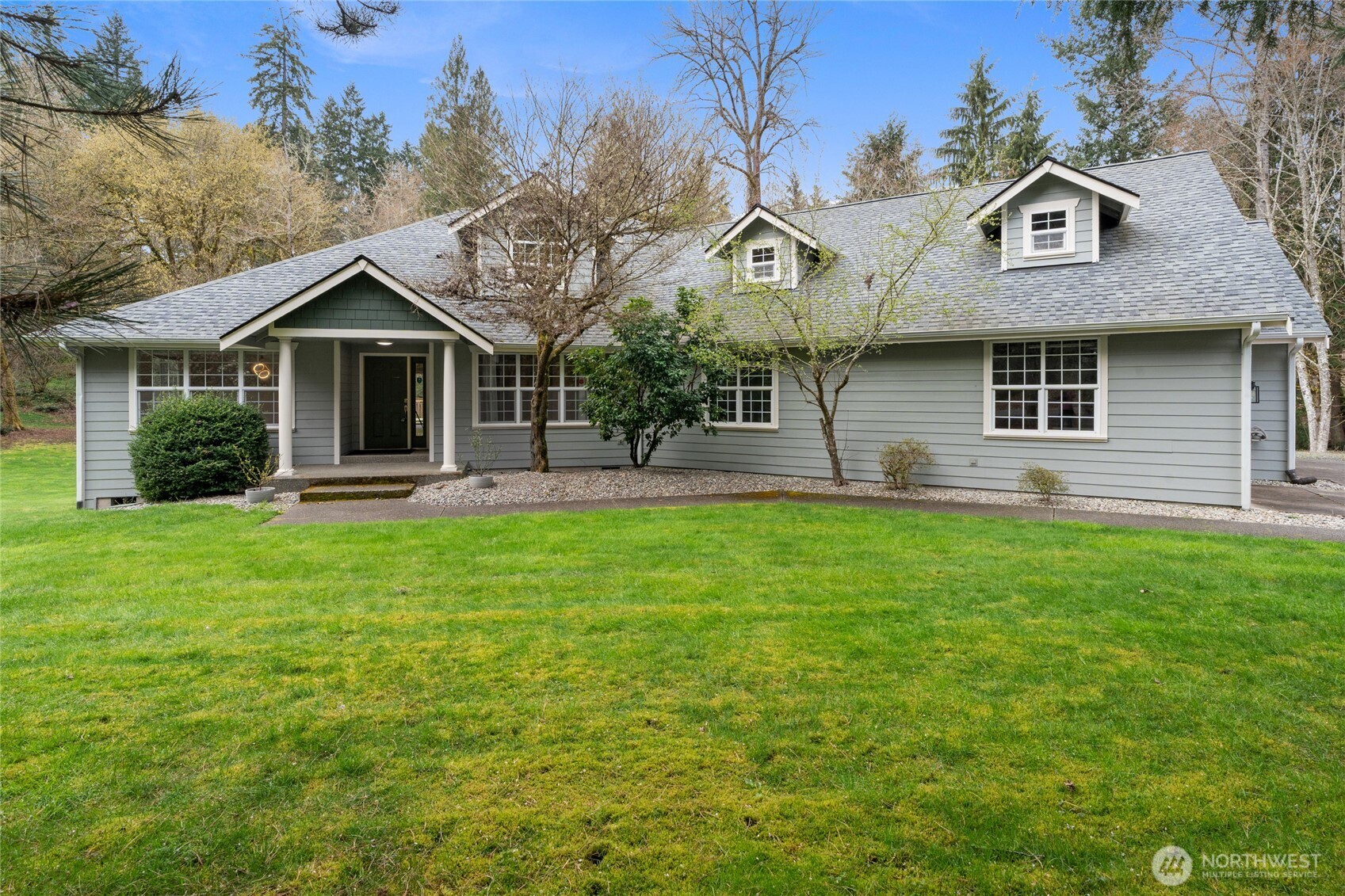 3841 Mari Lane Southeast Olympia, WA 98513 - Photo 2 of 40 a front view of a house with garden