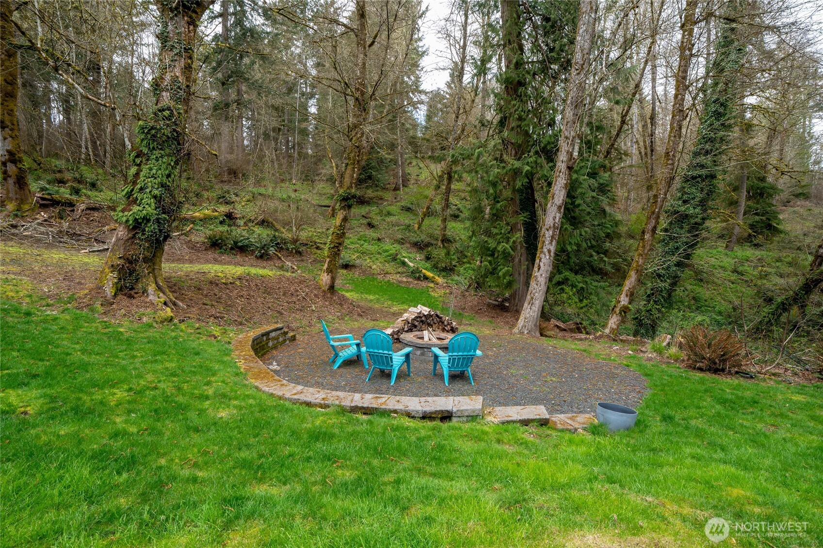 3841 Mari Lane Southeast Olympia, WA 98513 - Photo 29 of 40 a view of a table and chairs in the green field