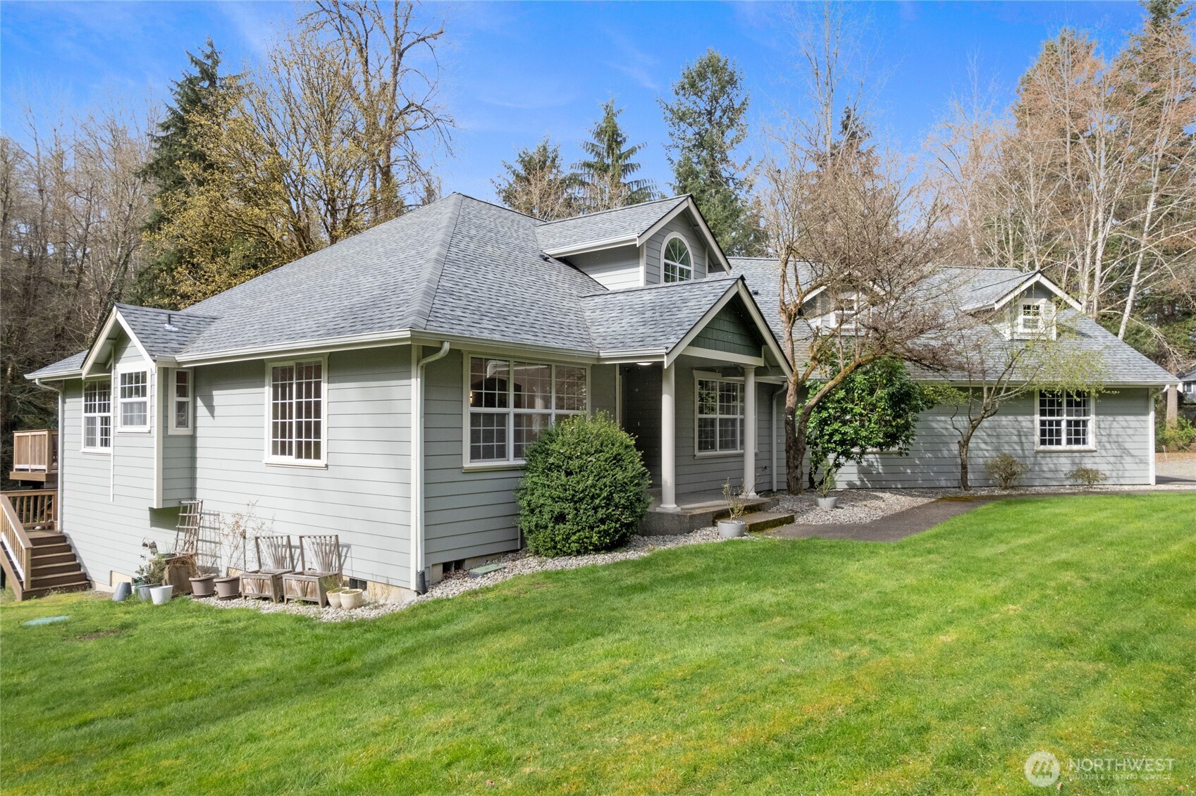 3841 Mari Lane Southeast Olympia, WA 98513 - Photo 30 of 40 a view of a house with a yard and sitting area
