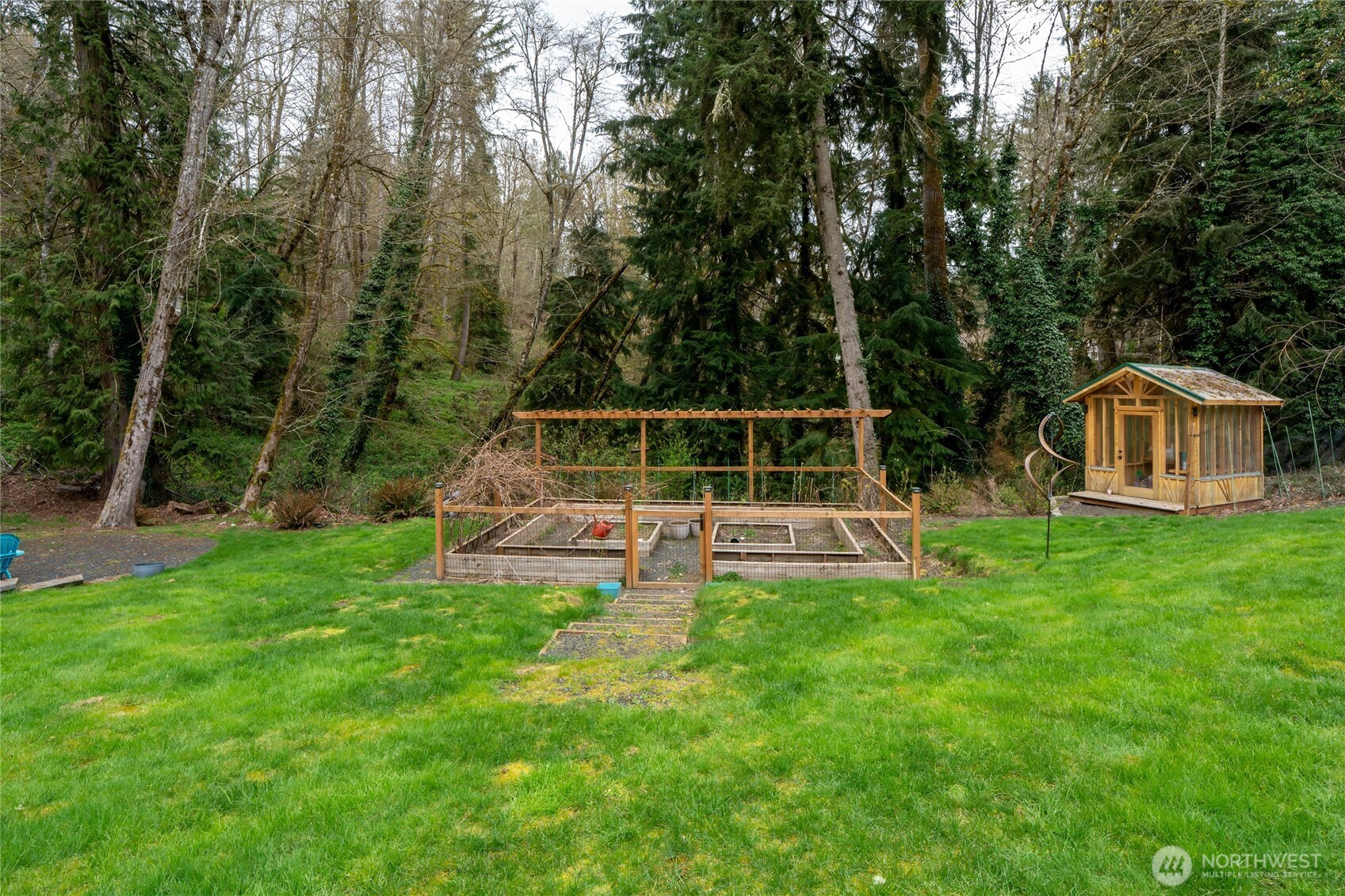 3841 Mari Lane Southeast Olympia, WA 98513 - Photo 32 of 40 a view of house with backyard and a slide