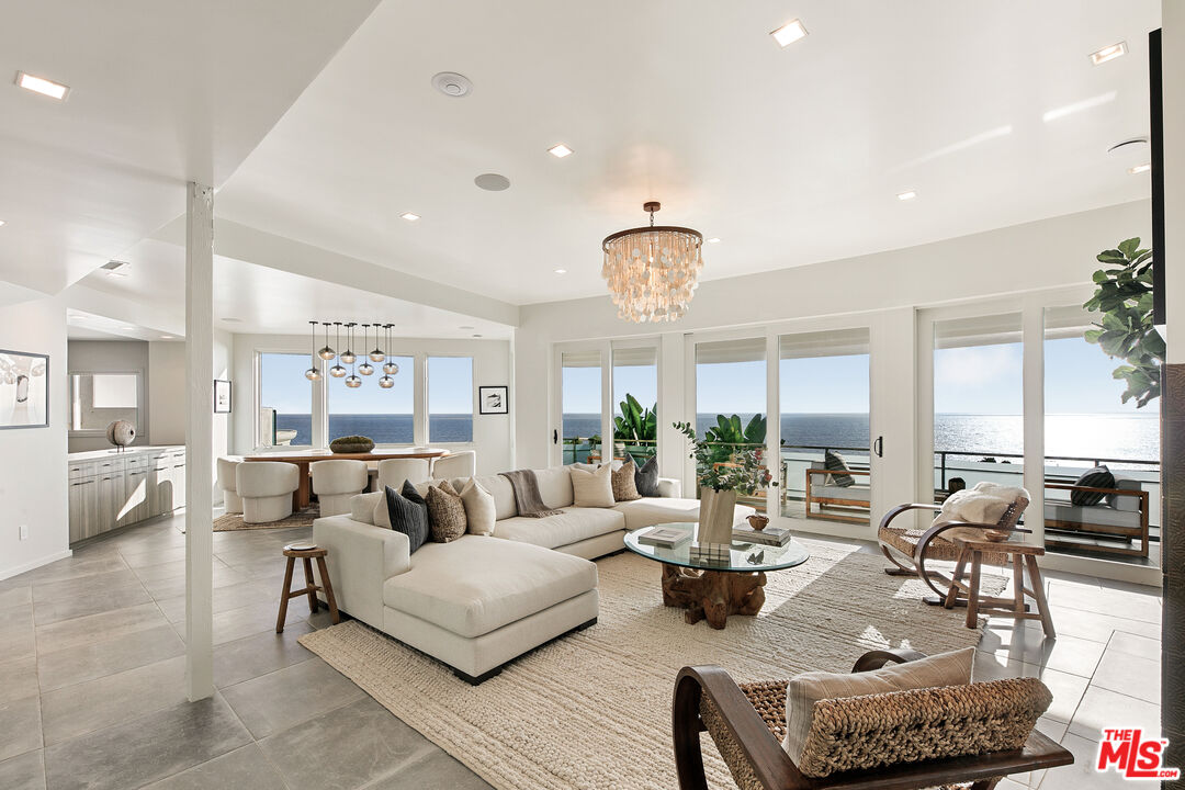 31558 Victoria Point Road Malibu, CA 90265 - Photo 5 of 55 a living room with furniture and a large window