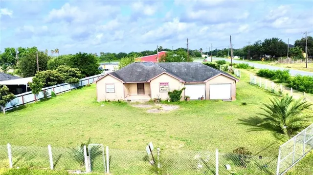 a swimming pool with trees in the background