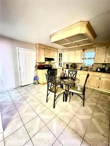 a bedroom with a bed and potted plant