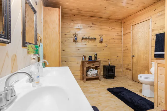 a bedroom with a bed and a mirror