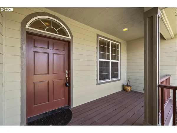 a view of front door with wooden floor