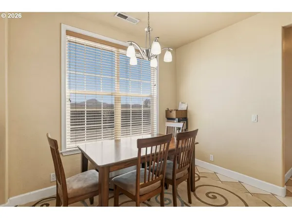 a view of a dining room with furniture and window