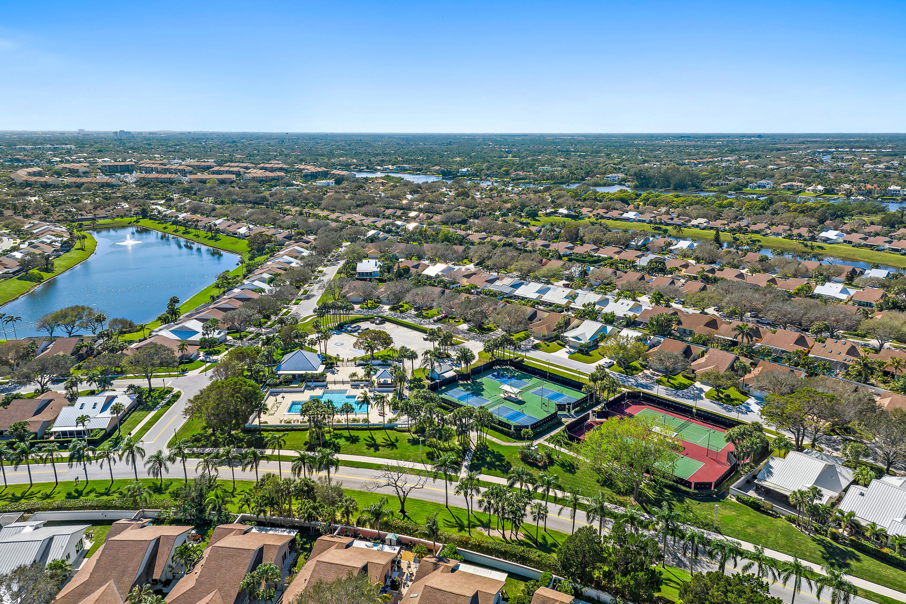 126 Cape Pointe Circle Jupiter, FL 33477 - Photo 1 of 3 an aerial view of residential houses with outdoor space