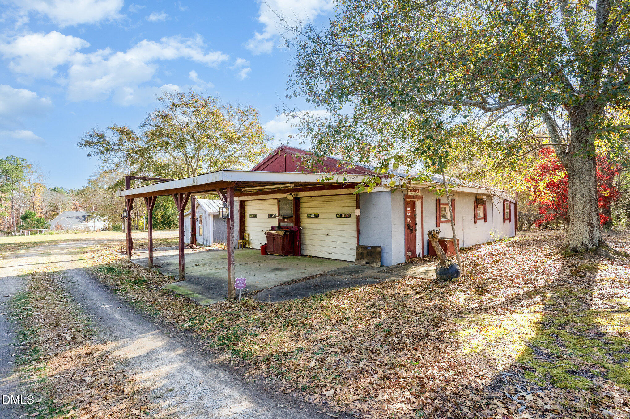 2396 Mitchell Road Angier, NC 27501 - Photo 16 of 21 a view of a yard in front of a house with large tree