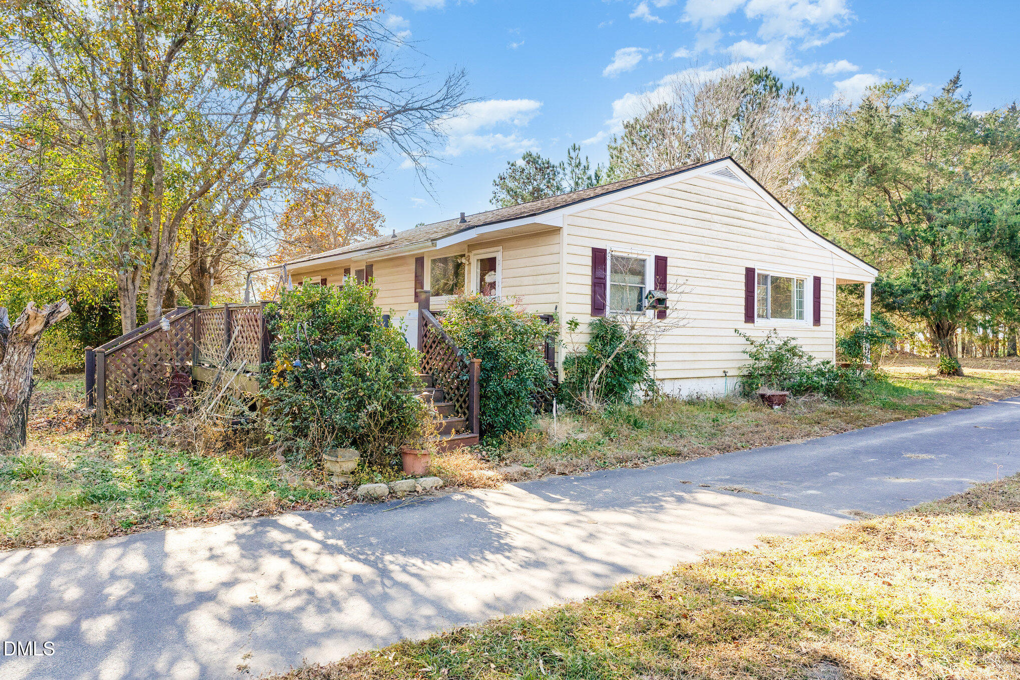 2396 Mitchell Road Angier, NC 27501 - Photo 3 of 21 a view of a yard in front of a house with large trees