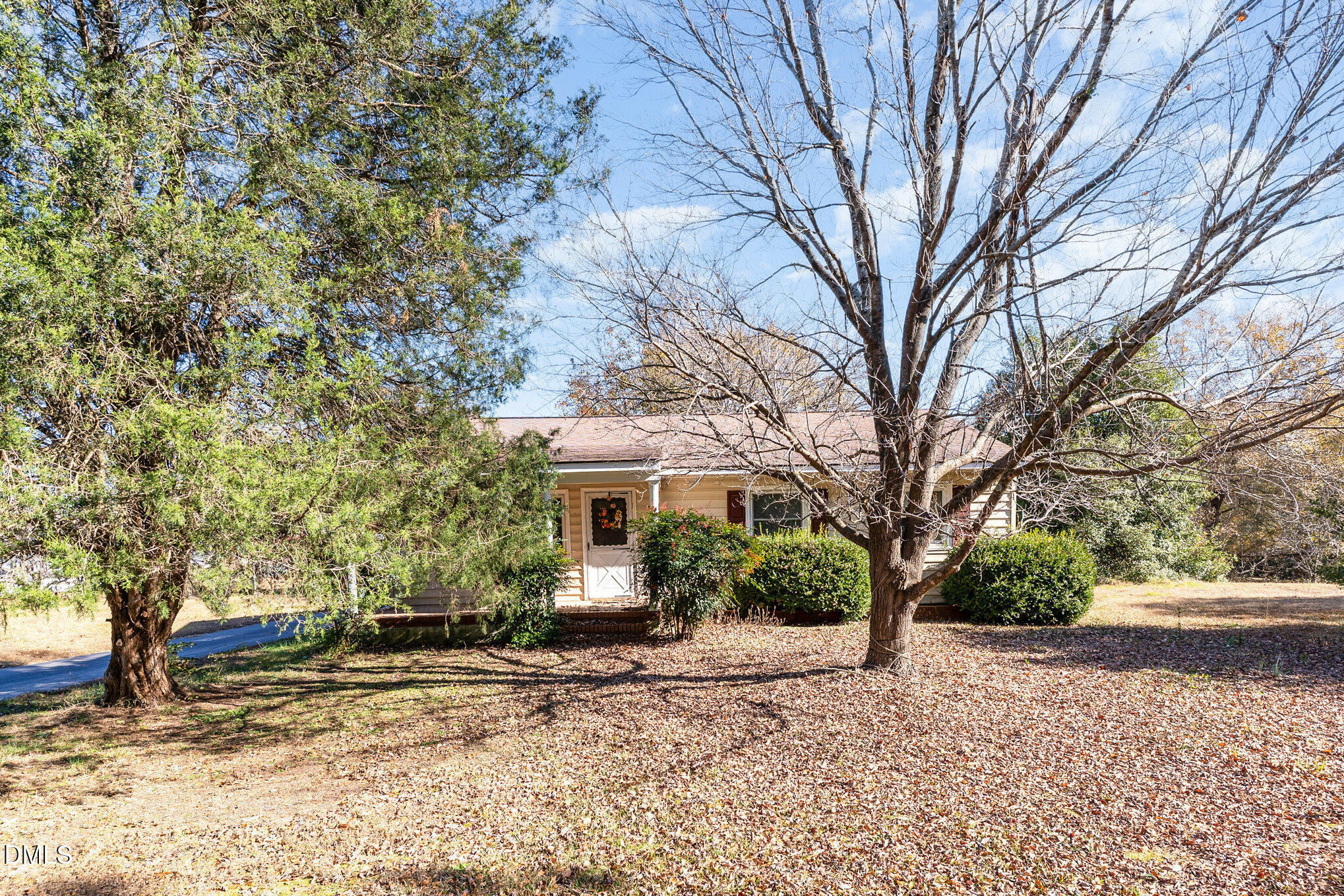 2396 Mitchell Road Angier, NC 27501 - Photo 5 of 21 a front view of a house with a yard and tree s