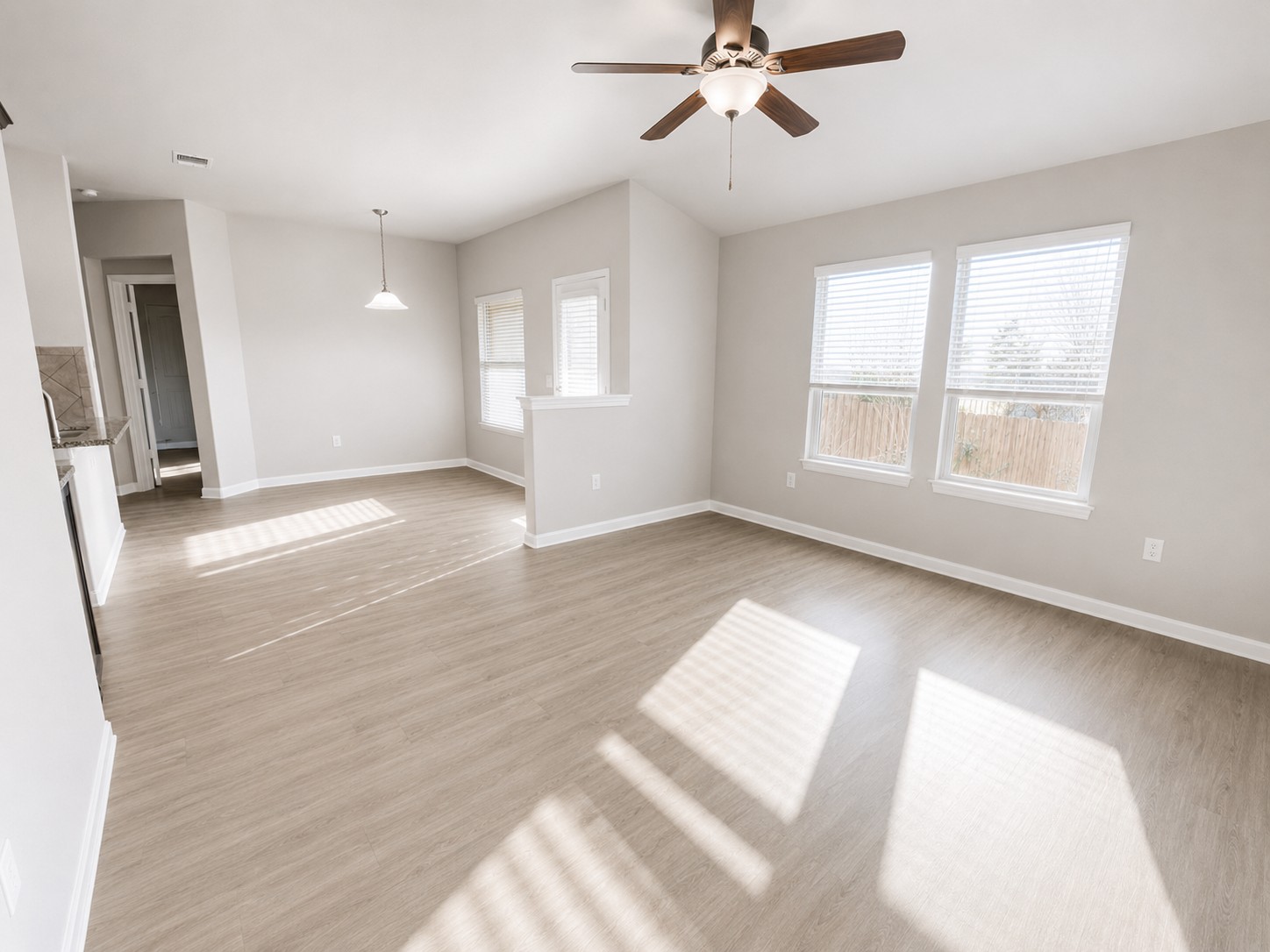 228 Avalanche Avenue Georgetown, TX 78626 - Photo 6 of 16 wooden floor in an empty room with a window