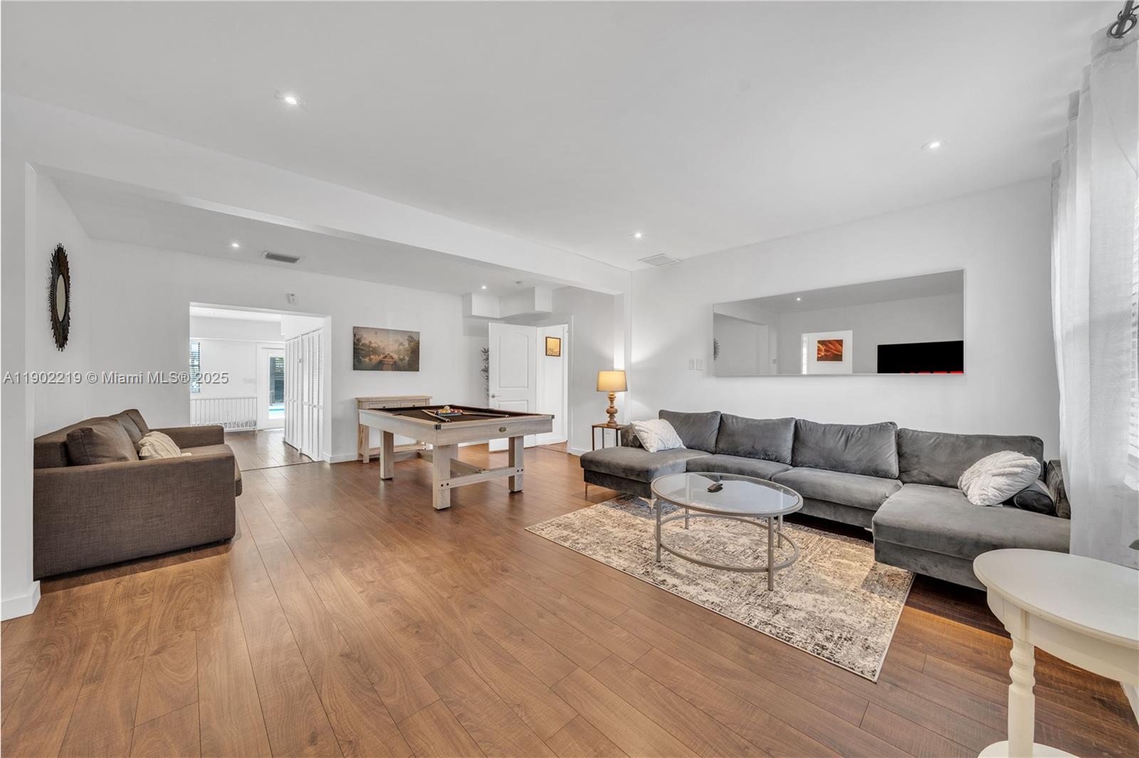710 Northeast 141st Street North Miami, FL 33161 - Photo 14 of 78 a living room with furniture and view of kitchen