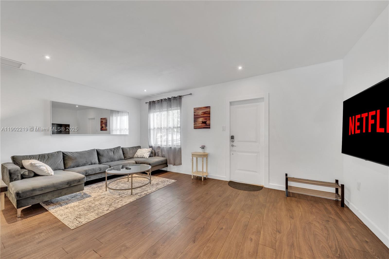 710 Northeast 141st Street North Miami, FL 33161 - Photo 15 of 78 a living room with furniture and a flat screen tv