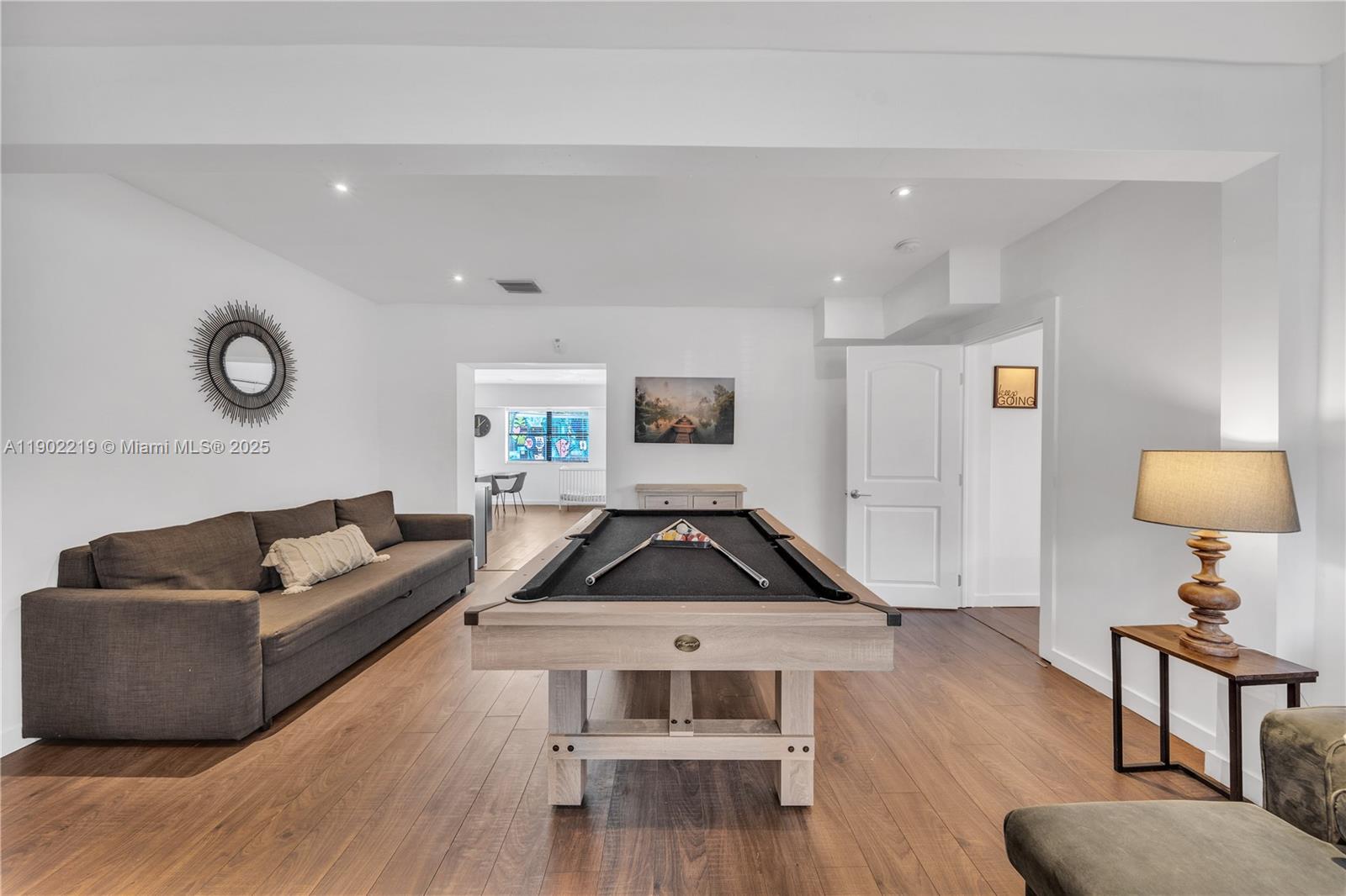 710 Northeast 141st Street North Miami, FL 33161 - Photo 18 of 78 a living room with furniture and a wooden floor