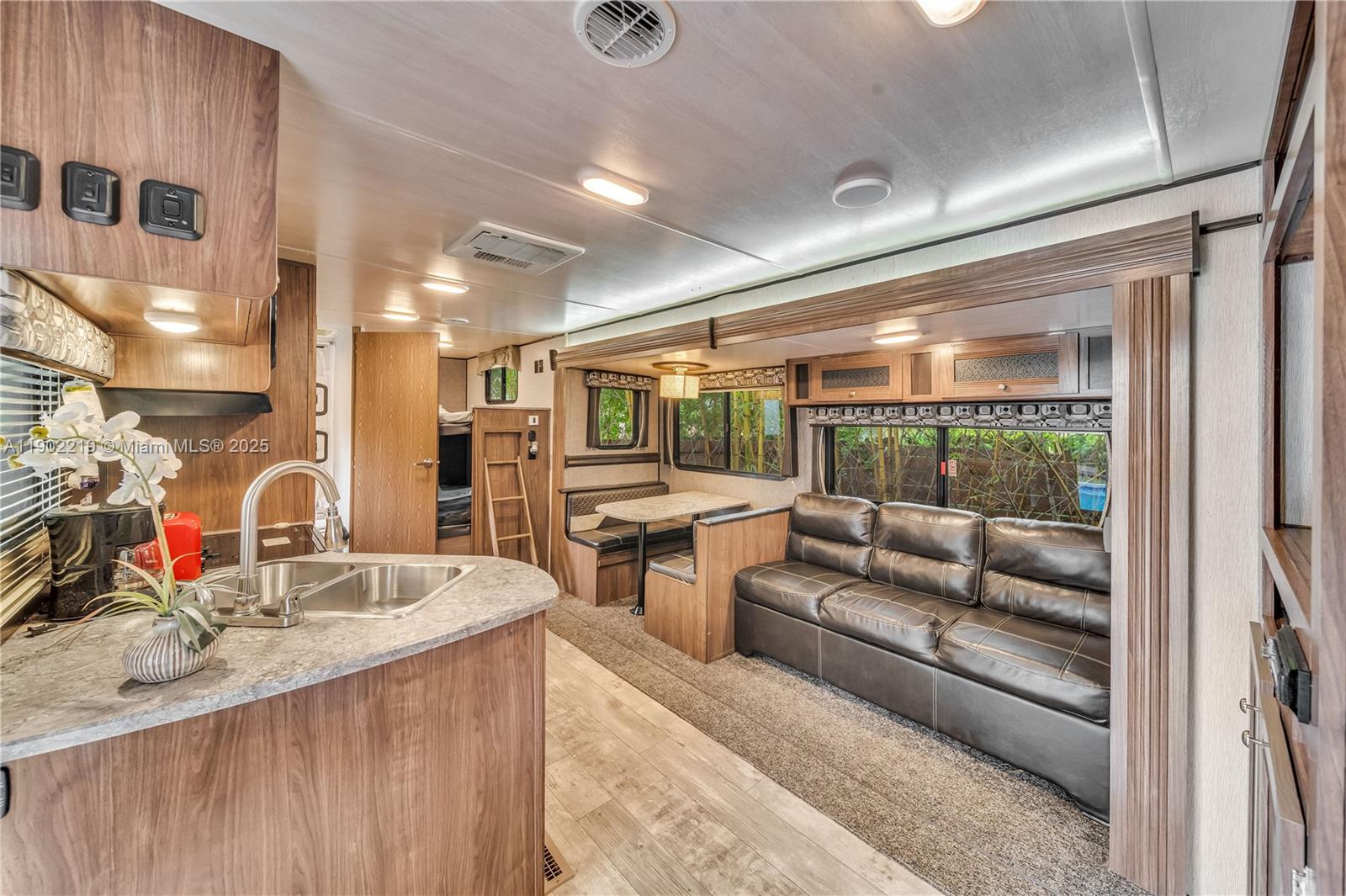 710 Northeast 141st Street North Miami, FL 33161 - Photo 19 of 78 a living room with furniture and a large window