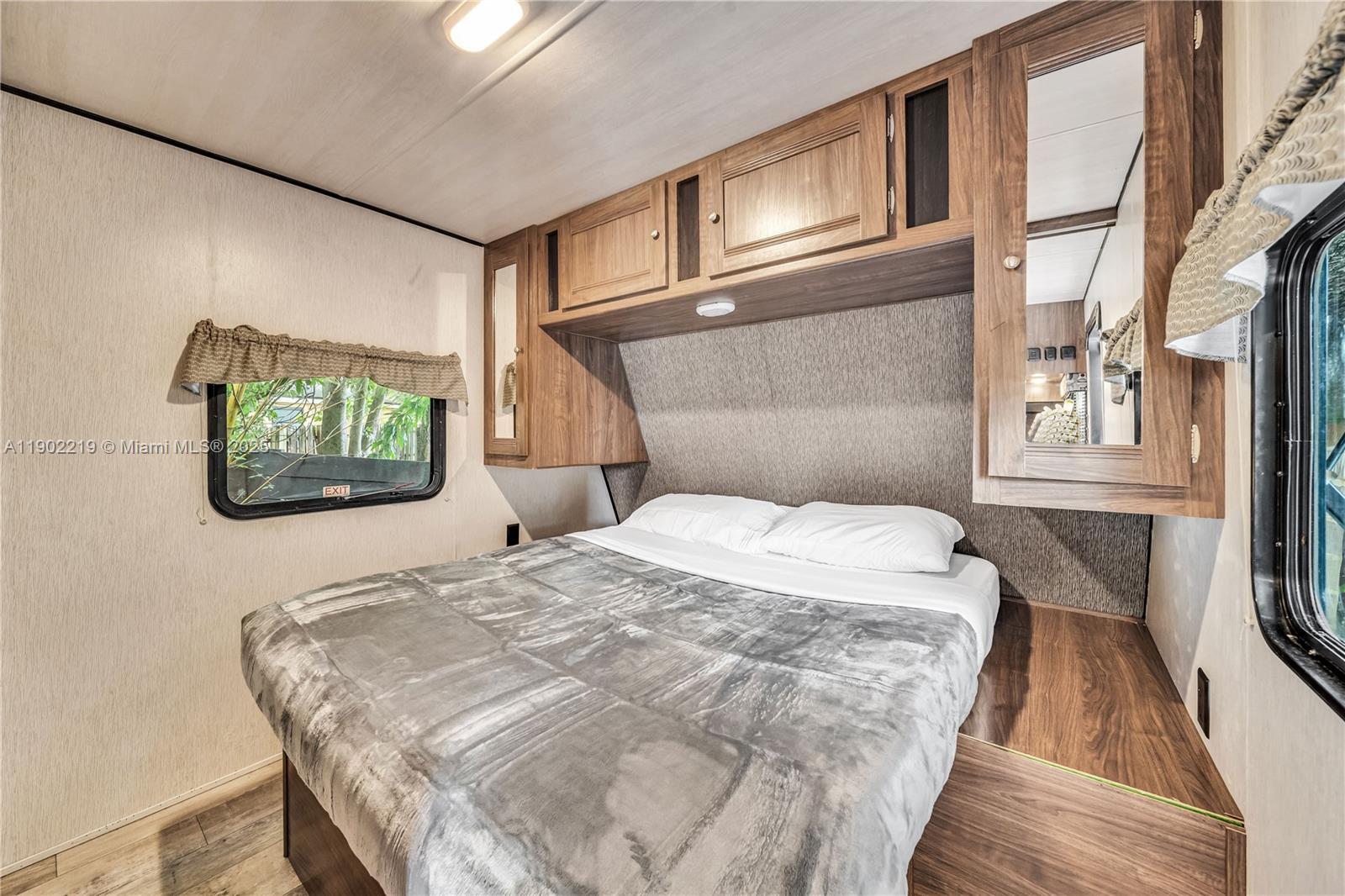 710 Northeast 141st Street North Miami, FL 33161 - Photo 20 of 78 a bedroom with a bed and a window