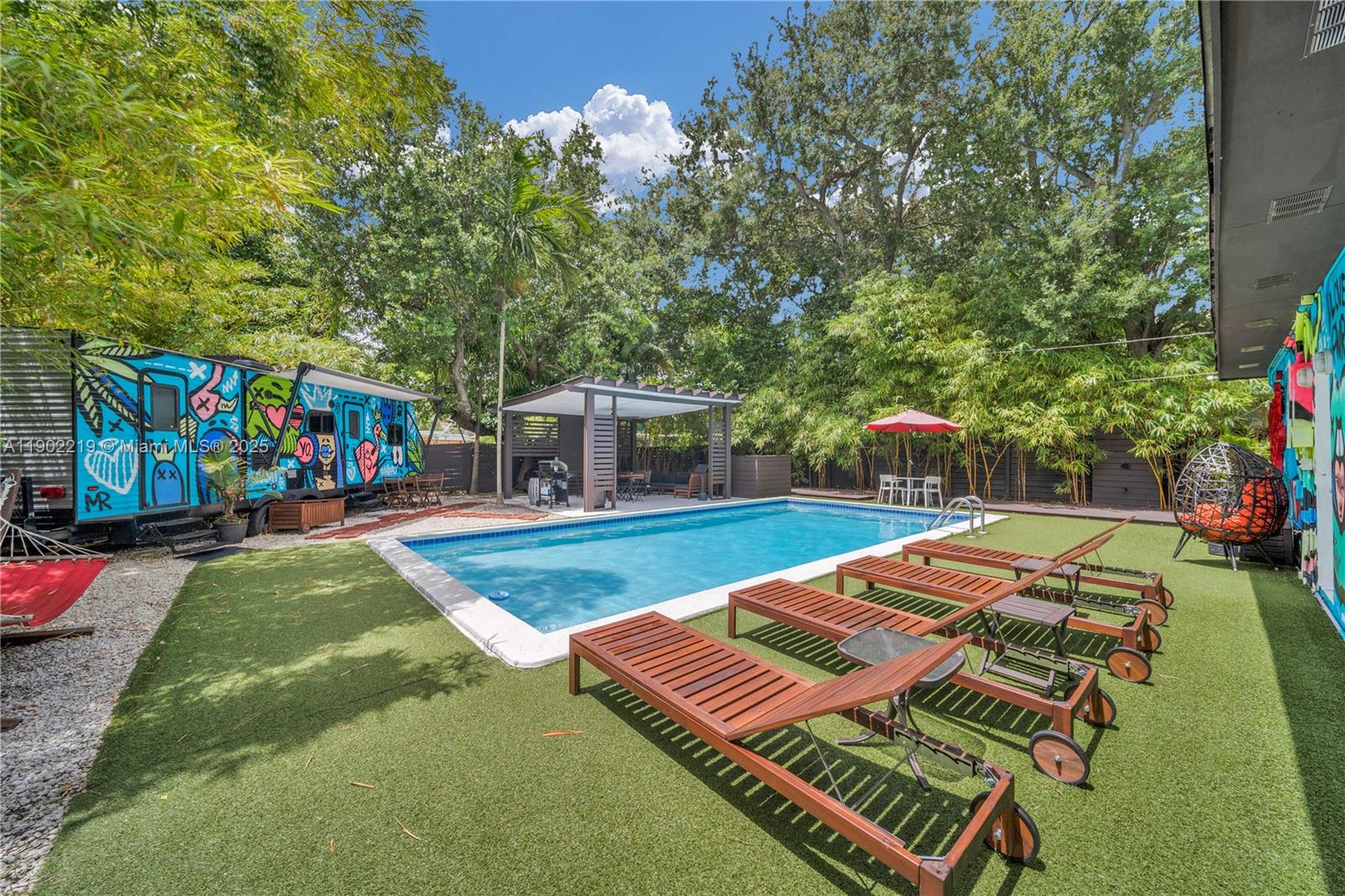 710 Northeast 141st Street North Miami, FL 33161 - Photo 32 of 78 a view of a backyard with swimming pool
